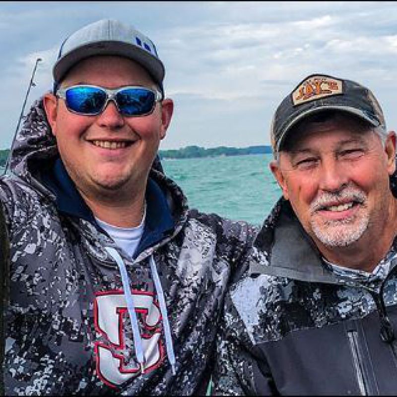 Mark and Jake Romanck Holding A Fish